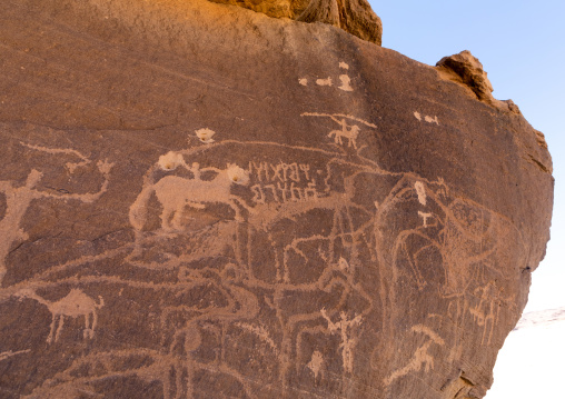 Petroglyphs on a rock depicting hunters, Najran Province, Thar, Saudi Arabia