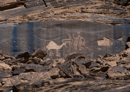 Petroglyphs rock art depicting humans and camel, Najran Province, Minshaf, Saudi Arabia