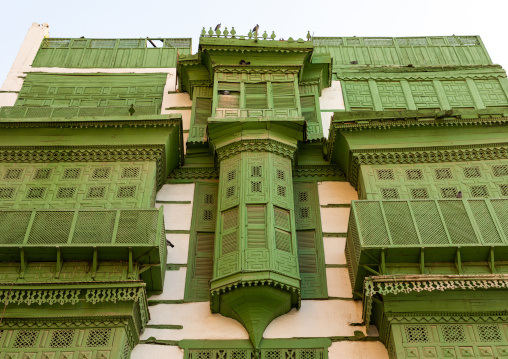 Old house with green wooden mashrabiya in al-Balad quarter, Mecca province, Jeddah, Saudi Arabia