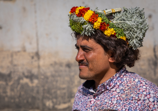 Portrait of a flower man wearing a floral crown on the head, Jizan Province, Addayer, Saudi Arabia