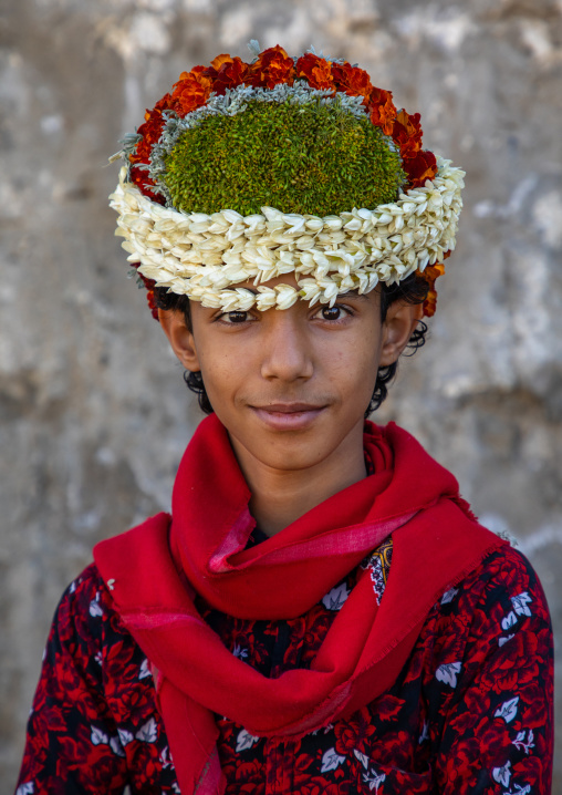 Portrait of a flower boy wearing a floral crown on the head, Jizan Province, Addayer, Saudi Arabia