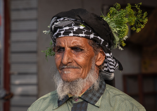 Portrait of a flower man wearing a floral crown on the head, Jizan Province, Mahalah, Saudi Arabia