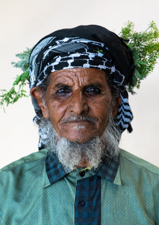 Portrait of a flower man wearing a floral crown on the head, Jizan Province, Mahalah, Saudi Arabia