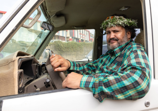 Portrait of a flower man wearing a floral crown on the head in his car, Jizan Province, Addayer, Saudi Arabia