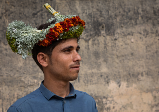 Portrait of a flower man wearing a floral crown on the head, Jizan Province, Addayer, Saudi Arabia