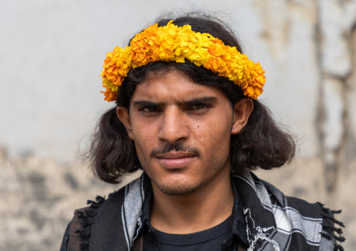 Portrait of a flower man wearing a yellow floral crown on the head, Jizan Province, Addayer, Saudi Arabia