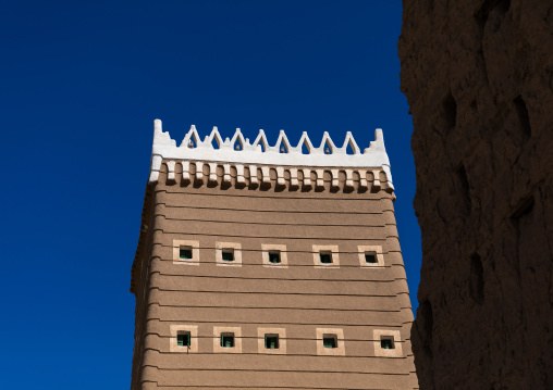 Traditional old mud house against blue sky, Najran Province, Najran, Saudi Arabia