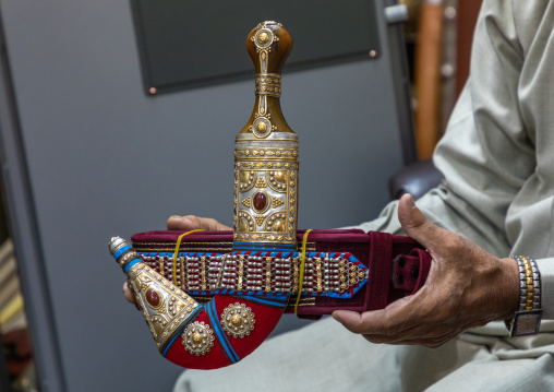 Saudi man holding a janbiya dagger, Najran Province, Najran, Saudi Arabia