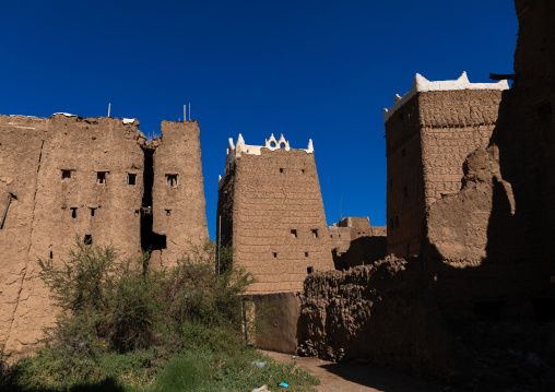 Old village of traditional mud houses against blue sky, Asir province, Dhahran Al Janub, Saudi Arabia