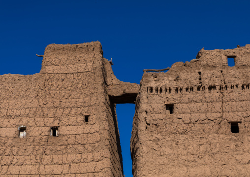 Bridge between traditional old mud houses, Asir province, Dhahran Al Janub, Saudi Arabia