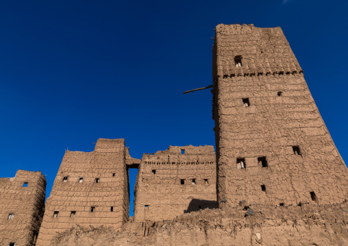 Old village of traditional mud houses against blue sky, Asir province, Dhahran Al Janub, Saudi Arabia