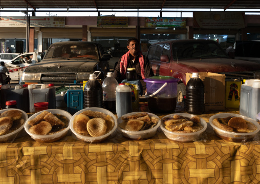 Saudi man selling honey and honeycombs on a market, Asir province, Al Habeel, Saudi Arabia