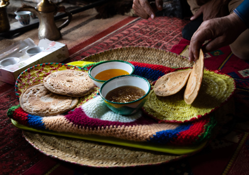 Bread with ghee and honey served to guests in a majlis, Asir province, Tanomah, Saudi Arabia