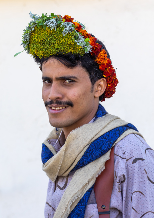 Portrait of a flower man wearing a floral crown on the head, Jizan Province, Addayer, Saudi Arabia