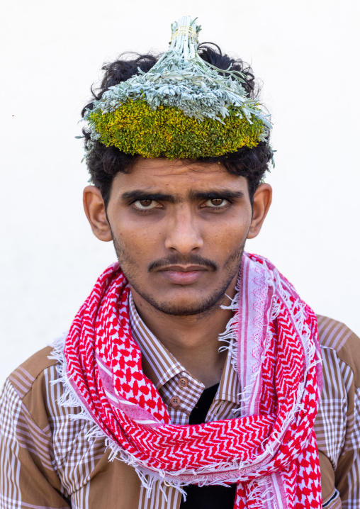 Portrait of a flower man wearing a floral crown on the head, Jizan Province, Addayer, Saudi Arabia