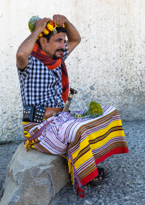 Portrait of a flower man making a floral crown on his head, Jizan Province, Addayer, Saudi Arabia