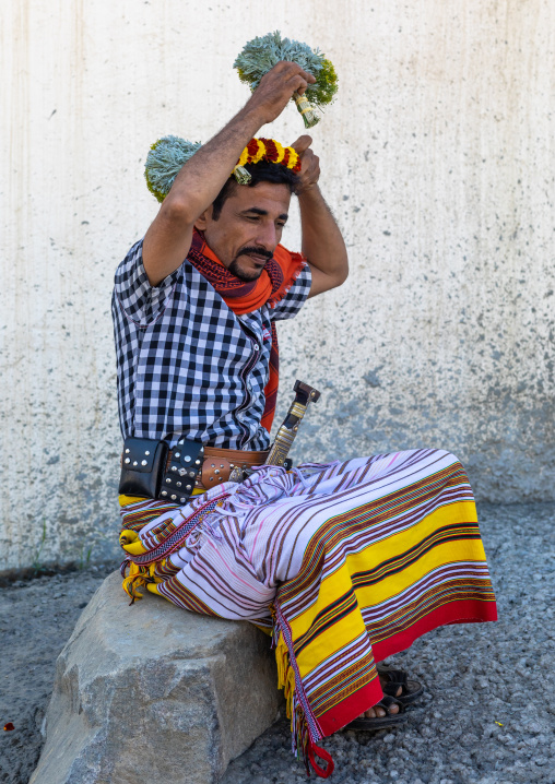 Portrait of a flower man making a floral crown on his head, Jizan Province, Addayer, Saudi Arabia