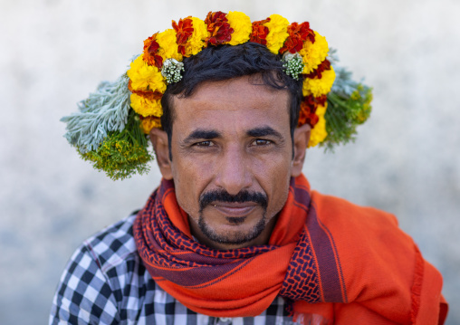 Portrait of a flower man wearing a floral crown on the head, Jizan Province, Addayer, Saudi Arabia