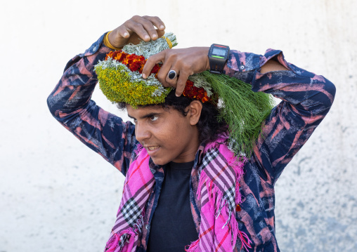 Portrait of a flower man making a floral crown on his head, Jizan Province, Addayer, Saudi Arabia