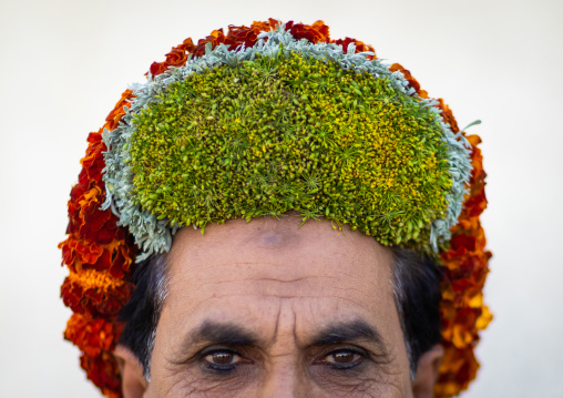 Portrait of a flower man wearing a floral crown on the head, Jizan Province, Addayer, Saudi Arabia