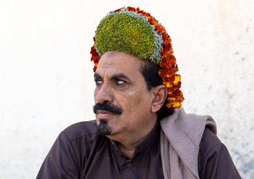 Portrait of a flower man wearing a floral crown on the head, Jizan Province, Addayer, Saudi Arabia