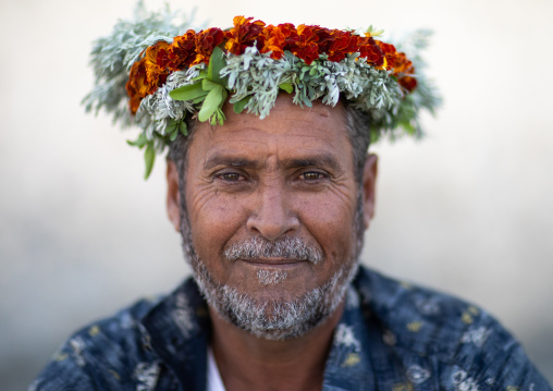 Portrait of a flower man wearing a floral crown on the head, Jizan Province, Addayer, Saudi Arabia