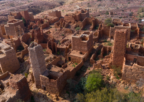 Aerial view of red stone and mud houses with slates in a village, Asir province, Sarat Abidah, Saudi Arabia