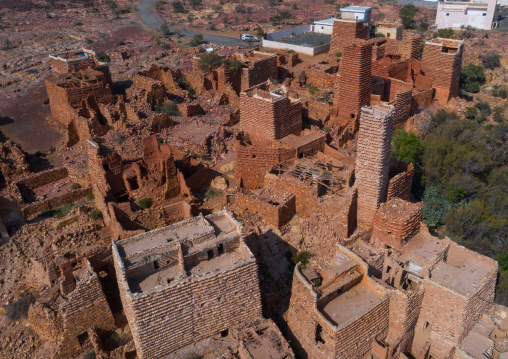 Aerial view of red stone and mud houses with slates in a village, Asir province, Sarat Abidah, Saudi Arabia