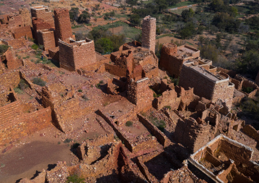 Aerial view of red stone and mud houses with slates in a village, Asir province, Sarat Abidah, Saudi Arabia