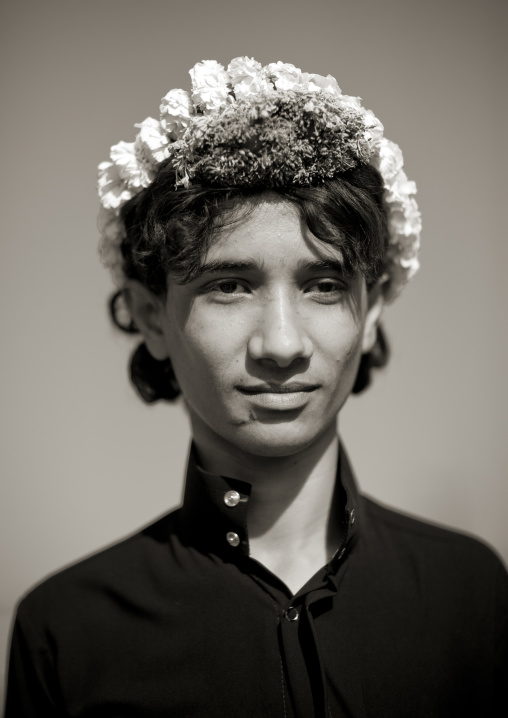 Portrait of a flower man wearing a floral crown on the head, Jizan province, Addayer, Saudi Arabia