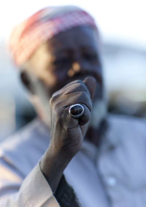 Portrait of a saudi man showing his ring, Najran Province, Najran, Saudi Arabia