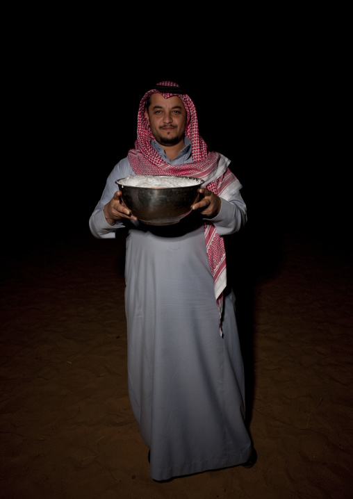 Saudi man drinking camel milk, Al-Jawf Province, Sakaka, Saudi Arabia