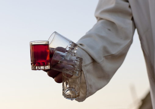 Saudi man serving tea, Al-Jawf Province, Sakaka, Saudi Arabia