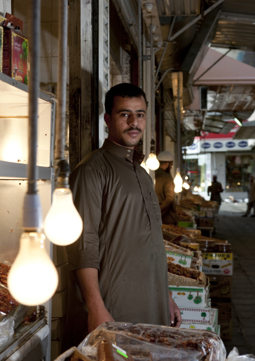 Man selling dates in the souk, Mecca Province, Taif, Saudi Arabia