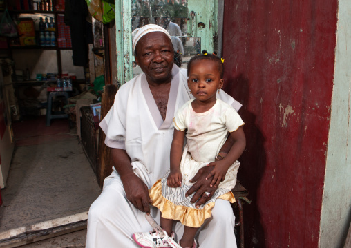 Father and his daughter in front of a shop, Hijaz Tihamah region, Jeddah, Saudi Arabia