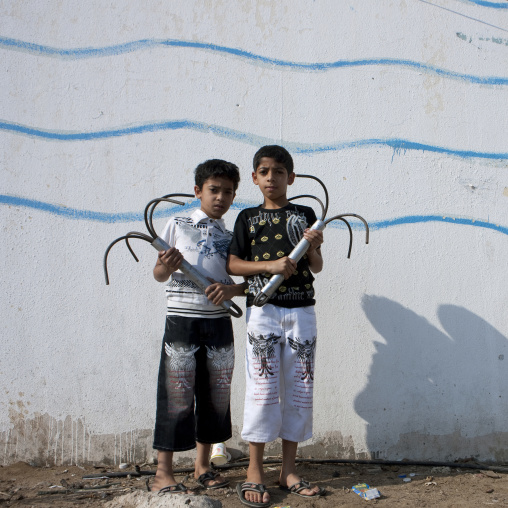 Saudi boys in the Fish market, Mecca province, Jeddah, Saudi Arabia