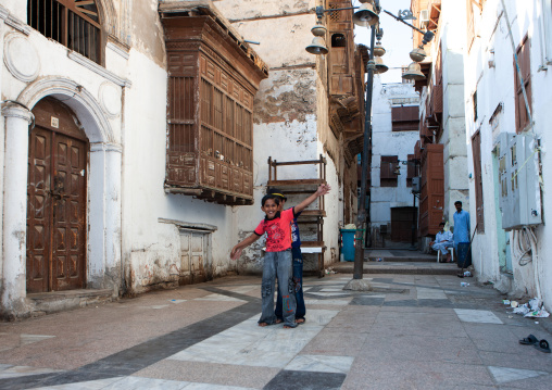 Boys dancing in a street of the old quarter, Hijaz Tihamah region, Jeddah, Saudi Arabia