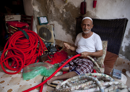 Old man making shishas in a shop, Mecca province, Jeddah, Saudi Arabia