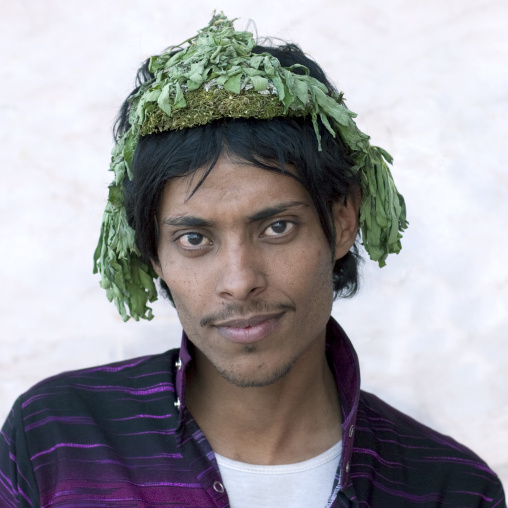 Portrait of a flower man wearing a floral crown on the head, Jizan province, Addayer, Saudi Arabia