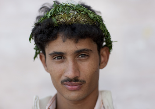 Portrait of a flower man wearing a floral crown on the head, Jizan province, Addayer, Saudi Arabia