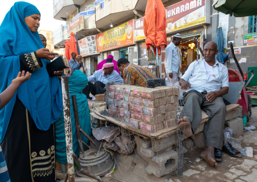 Wads of money changer on his stall 
, Woqooyi Galbeed region, Hargeisa, Somaliland