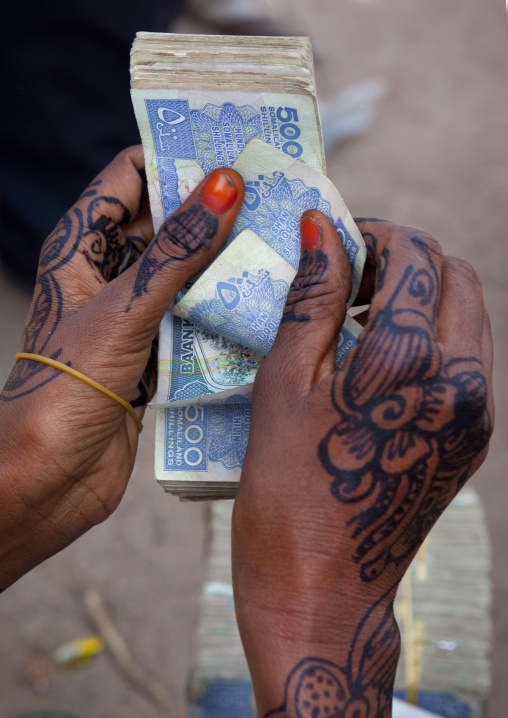 A Woman Is Counting Five Hundred Schillings With Her Painted Hands, Hargeisa, Somaliland