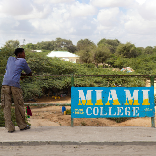 Standing Man Resting His Elbow On A Fence At Miami College, Hargeisa, Somaliland