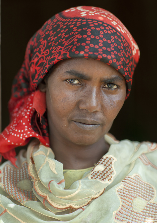 Portrait Of A Serious Looking Woman Wearing A Red Hijab, Hargeisa, Somaliland