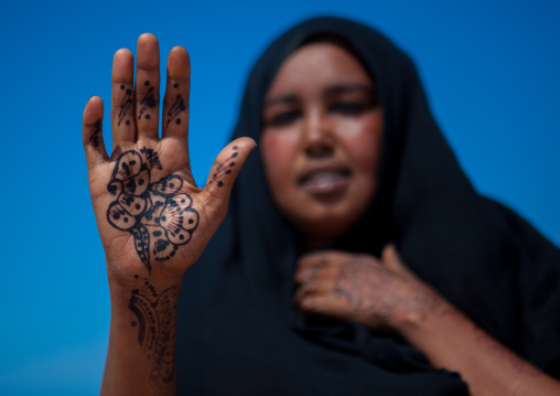 A somali woman showing her hand painted with henna, North-Western province, Berbera, Somaliland