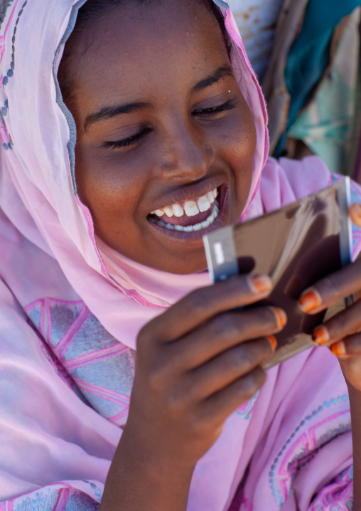 Portrait of a somali young woman dicvovering herself on a polaroid picture, North-Western province, Berbera, Somaliland