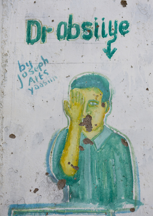 An Optician Advertisement Painted Billboard Depicting A Man Taking An Eye Test, Boorama, Somaliland