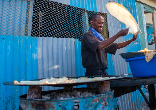 Somali man making somali flatbread in the street, Woqooyi Galbeed region, Hargeisa, Somaliland