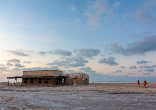 Somali women near an old house on the beach, Awdal region, Zeila, Somaliland