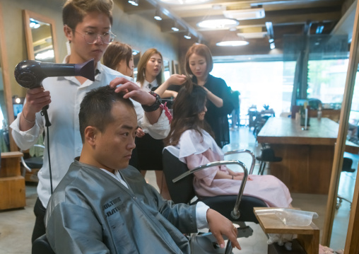 North korean defector joseph park with his south korean fiancee juyeon in a beauty saloon, National capital area, Seoul, South korea